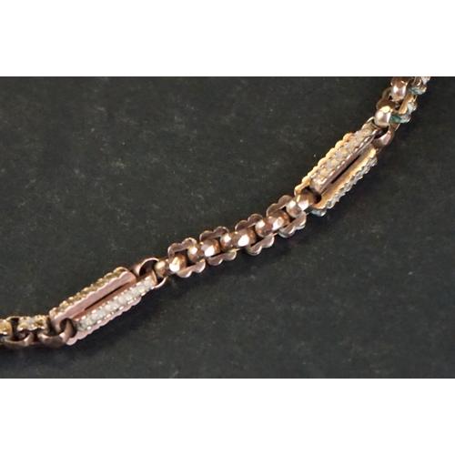 390A - Victorian 9ct gold Albert chain, fancy figaro link chain with applied 9c pad, the two toggles and t ... 