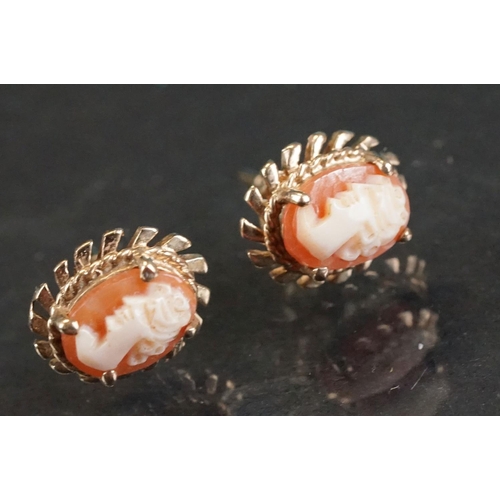 311A - Four pairs of 9ct yellow gold stud earrings, to include cameo and pearl examples, together with a 9c... 