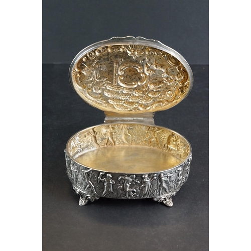 523 - Late Victorian silver lidded trinket box, the hinged lid with repoussé bird and animal decoration, f... 