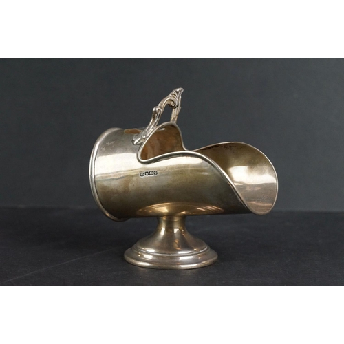 526 - Silver sugar bowl modelled as a coal scuttle with scoop, plain polished body with ribbed border, mou... 