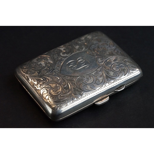 527 - Silver cigarette case, engraved foliate scroll decoration, the shield shaped cartouche with engraved... 