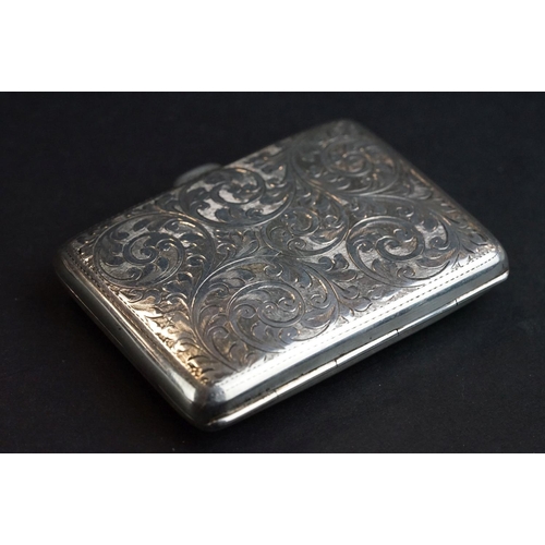 527 - Silver cigarette case, engraved foliate scroll decoration, the shield shaped cartouche with engraved... 