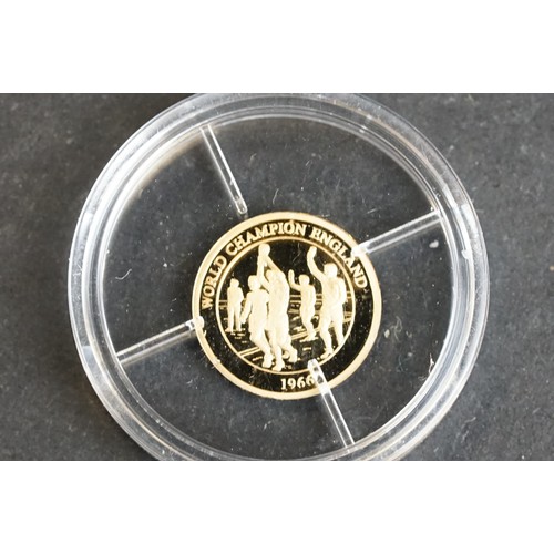 212 - A 'The Football World Champion' 14ct .585 gold collectors coin.