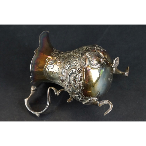 531 - George III silver sauce boat, pie crust border, scroll handle, plain polished body raised on three h... 