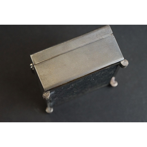 538 - Silver cigarette case, tapered ribbed thumbpiece to the hinged lid, engine turned decoration, the bo... 