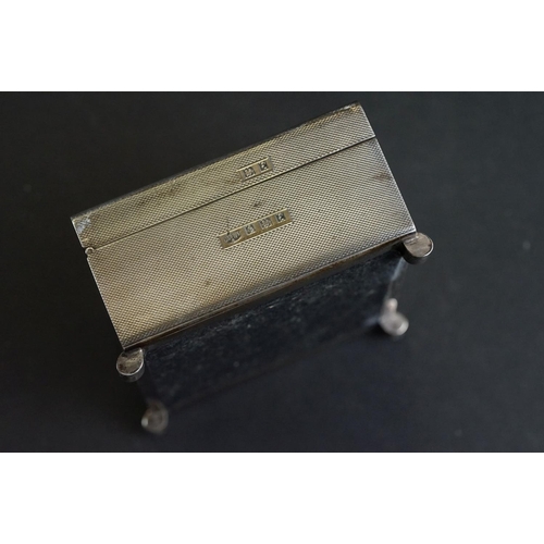 538 - Silver cigarette case, tapered ribbed thumbpiece to the hinged lid, engine turned decoration, the bo... 