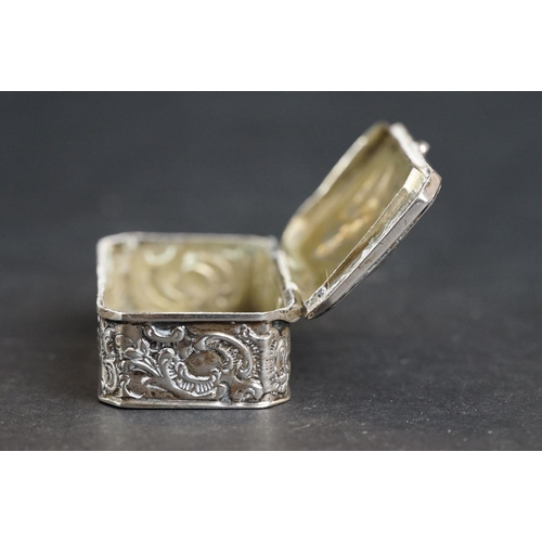 539 - Continental silver pill box, repoussé idyllic Shepherd and Shepherdess scene to the hinged lid, the ... 