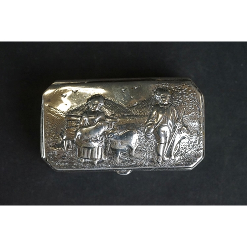 539 - Continental silver pill box, repoussé idyllic Shepherd and Shepherdess scene to the hinged lid, the ... 