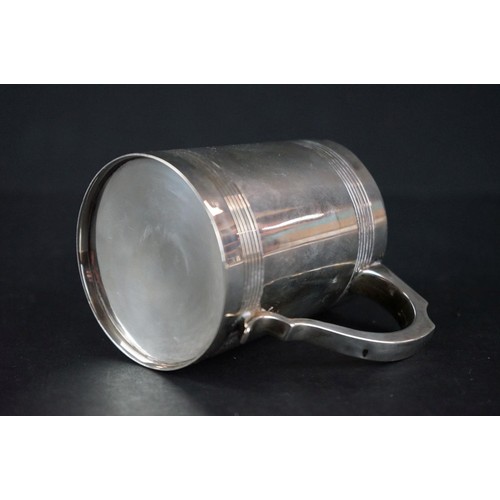 513 - Late Victorian silver tankard of plain polished form, with scrolling handle, presentation inscriptio... 