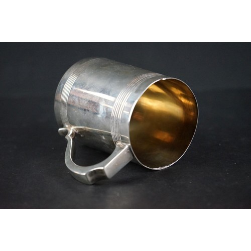 513 - Late Victorian silver tankard of plain polished form, with scrolling handle, presentation inscriptio... 