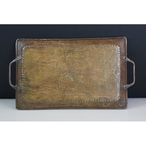 114 - John Pearson Arts & Crafts twin-handled hammered brass tray of rectangular form, impressed J.P to ba... 