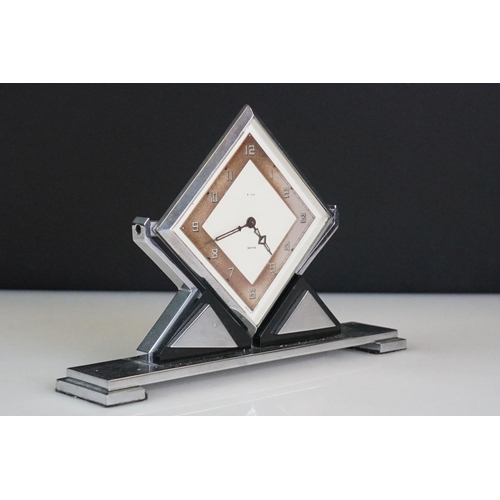 116 - Smiths Art Deco 8 Days desk clock of lozenge form, with Arabic numerals, hinged on geometric stand, ... 