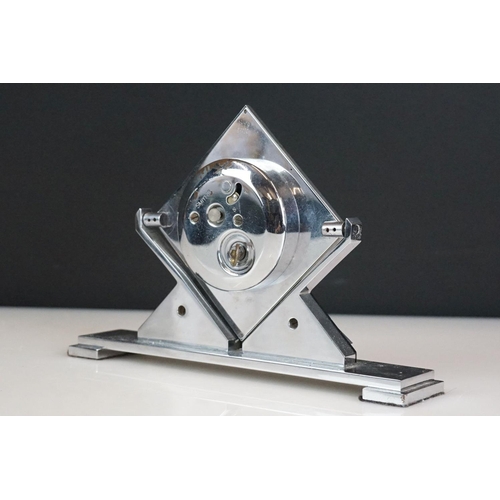 116 - Smiths Art Deco 8 Days desk clock of lozenge form, with Arabic numerals, hinged on geometric stand, ... 