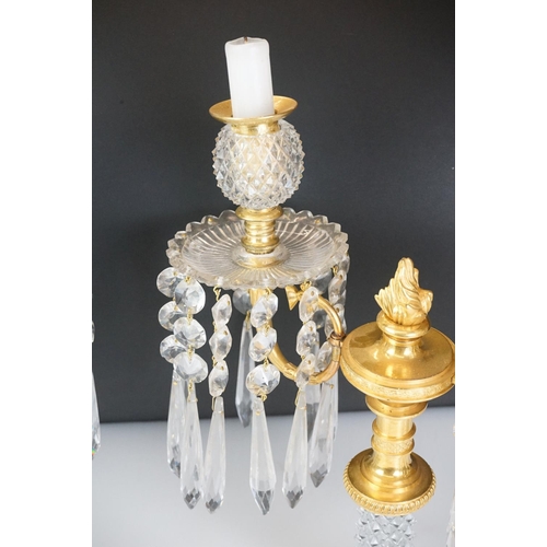 16 - Two early 20th Century cut glass and gilt metal two-branch candelabras, with cut glass stem and circ... 