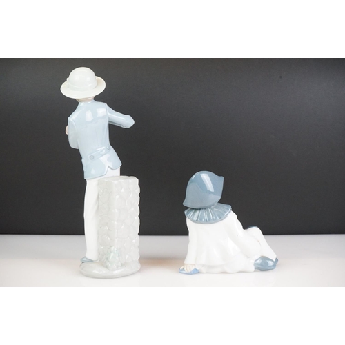 21 - Eight Spanish porcelain figures to include Nao by Lladro (boy holding a puppy, girl with basket of f... 