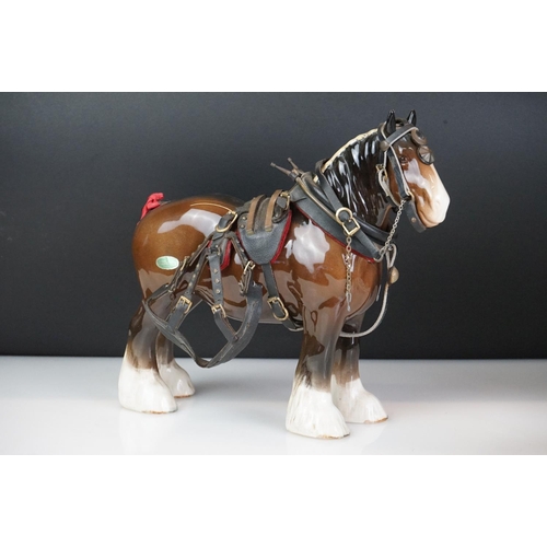 31 - Five Beswick horse figures to include a brown gloss shire horse with saddle, reins and harness (with... 