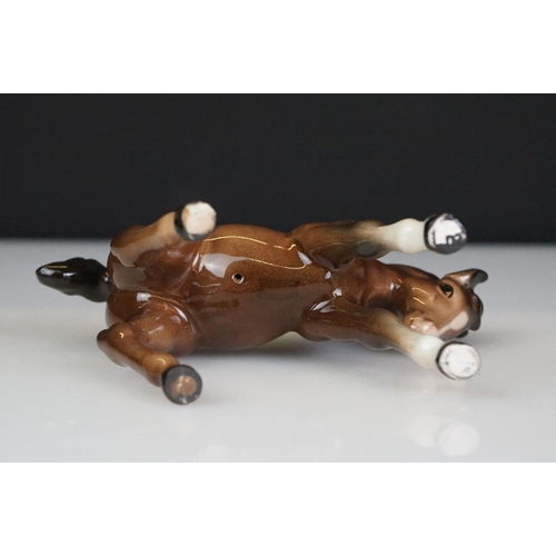 31 - Five Beswick horse figures to include a brown gloss shire horse with saddle, reins and harness (with... 