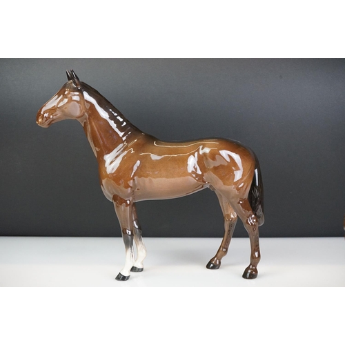 31 - Five Beswick horse figures to include a brown gloss shire horse with saddle, reins and harness (with... 