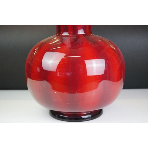 35 - Large contemporary red glass floor vase of baluster form, with white interior, approx 46.5cm high