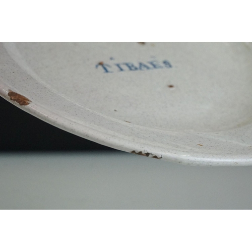 54 - Continental cream glazed pottery dish, entitled ' TIBAES ' approx. 23cm diameter