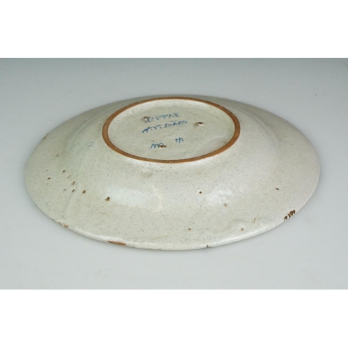 54 - Continental cream glazed pottery dish, entitled ' TIBAES ' approx. 23cm diameter