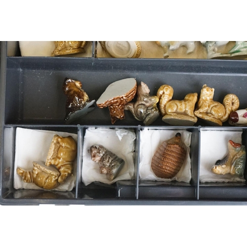 55 - Collection of over 55 Wade Whimsies contained within two plastic cases, to include squirrels, cats d... 