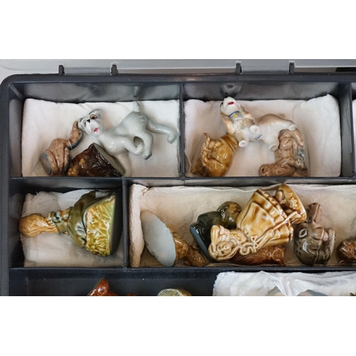 55 - Collection of over 55 Wade Whimsies contained within two plastic cases, to include squirrels, cats d... 