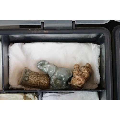 55 - Collection of over 55 Wade Whimsies contained within two plastic cases, to include squirrels, cats d... 