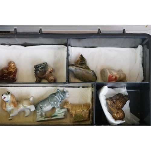 55 - Collection of over 55 Wade Whimsies contained within two plastic cases, to include squirrels, cats d... 