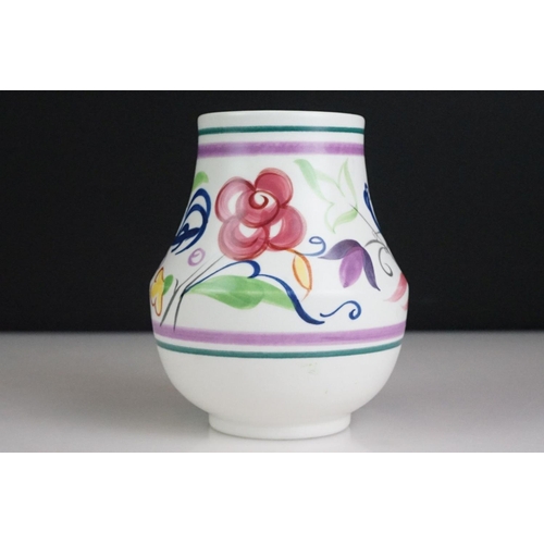 56 - Poole Pottery tapering vase with polychrome floral and scrolling decoration, approx 12.5cm high, tog... 