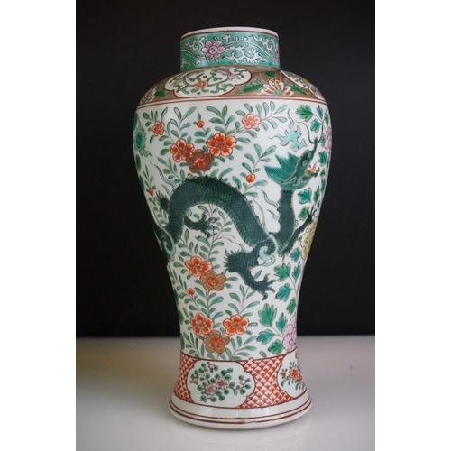 64 - Pair of Chinese Famille Verte vases decorated with dragons & foliage