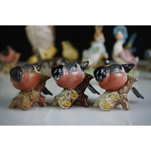 68 - Collection of 13 porcelain bird figures to include six Beswick no. 1042 Bullfinches, two Beswick Gre... 