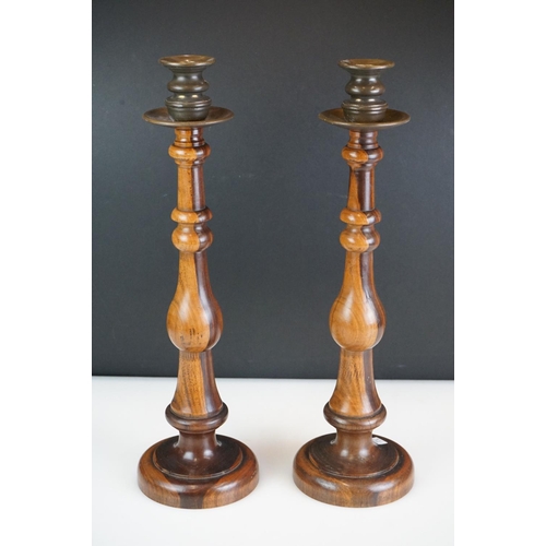 95 - Pair of large late 19th century lignum vitae turned candlesticks with brass drip tray and sconces