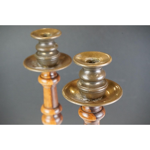 95 - Pair of large late 19th century lignum vitae turned candlesticks with brass drip tray and sconces