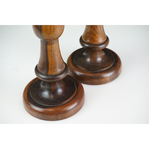 95 - Pair of large late 19th century lignum vitae turned candlesticks with brass drip tray and sconces