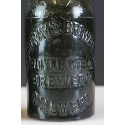 41 - Group of five beer bottles to include a stoneware Malvern Ginger Beer example, a glass Codd bottle, ... 