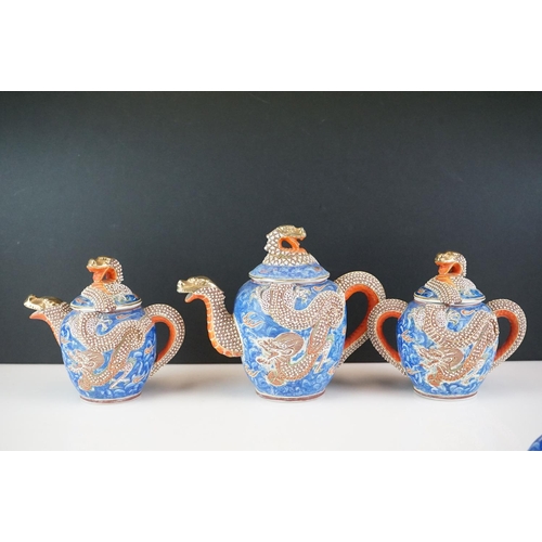 44 - Vintage Japanese moriage hand-painted dragon Kutani tea ware to include 2 lidded teapots (one lid a/... 