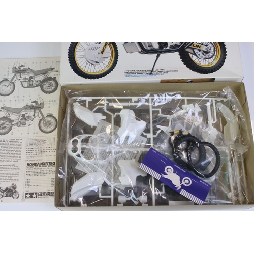 274 - Four boxed Tamiya plastic model motorbike kits to include 14055 Honda NSR500 Grand Prix Racer, 14054... 