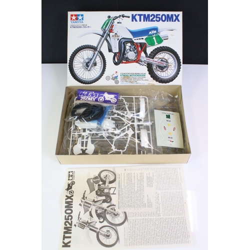 274 - Four boxed Tamiya plastic model motorbike kits to include 14055 Honda NSR500 Grand Prix Racer, 14054... 