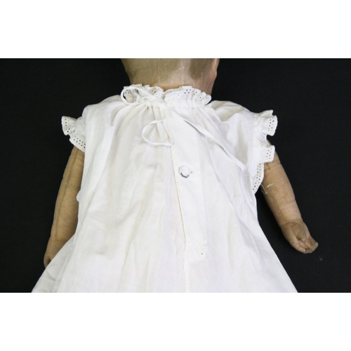 326 - Vintage fabric-covered baby doll dressed in a christening robe, with painted facial features, approx... 