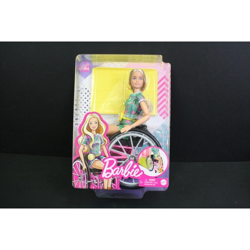 331 - Two boxed Mattel Barbie dolls in wheelchairs to include no. 165 & 166 plus a boxed Pedigree Sindy Sh... 