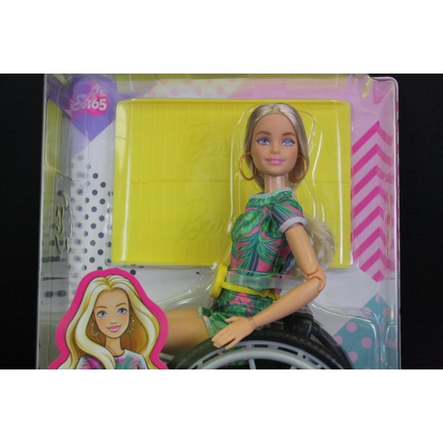 331 - Two boxed Mattel Barbie dolls in wheelchairs to include no. 165 & 166 plus a boxed Pedigree Sindy Sh... 