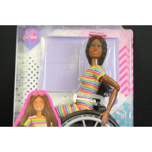 331 - Two boxed Mattel Barbie dolls in wheelchairs to include no. 165 & 166 plus a boxed Pedigree Sindy Sh... 