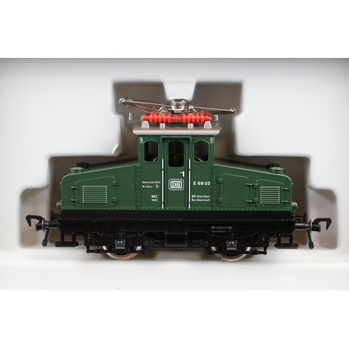 21 - Four boxed HO gauge locomotives to include Fleischmann 4300 and 3 x Rivarossi examples, condition va... 