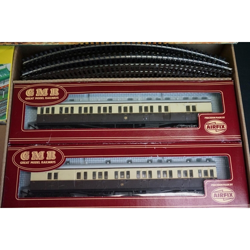 134 - Two boxed Airfix GMR OO gauge Suburban Passenger Sets, both with boxed locomotive and 2 x boxed coac... 