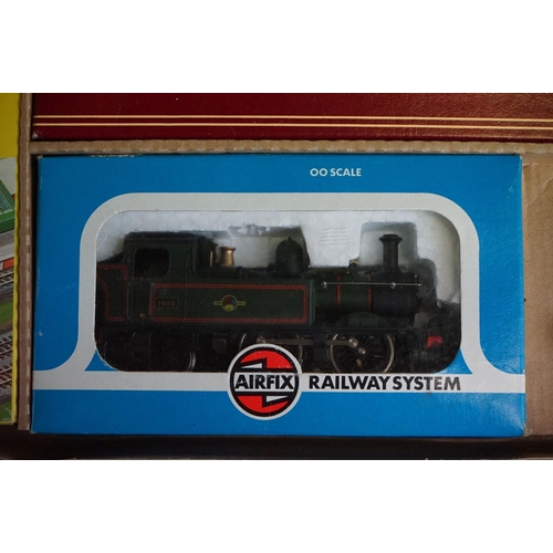 134 - Two boxed Airfix GMR OO gauge Suburban Passenger Sets, both with boxed locomotive and 2 x boxed coac... 