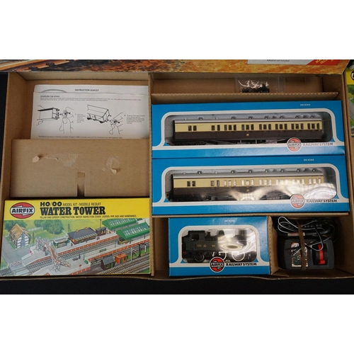 134 - Two boxed Airfix GMR OO gauge Suburban Passenger Sets, both with boxed locomotive and 2 x boxed coac... 