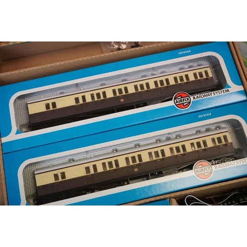 134 - Two boxed Airfix GMR OO gauge Suburban Passenger Sets, both with boxed locomotive and 2 x boxed coac... 