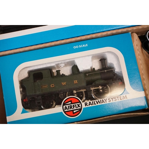 134 - Two boxed Airfix GMR OO gauge Suburban Passenger Sets, both with boxed locomotive and 2 x boxed coac... 