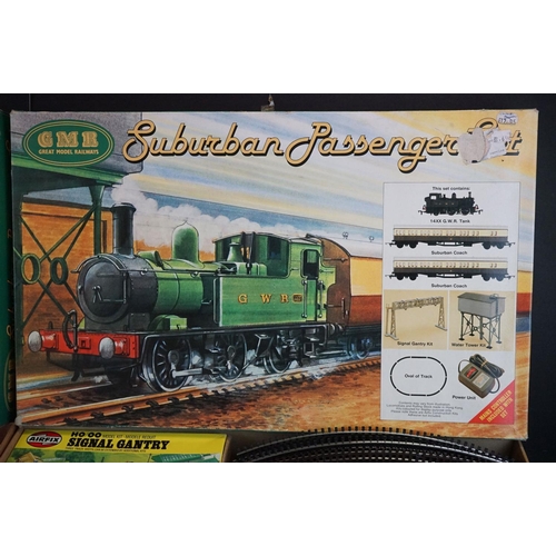 134 - Two boxed Airfix GMR OO gauge Suburban Passenger Sets, both with boxed locomotive and 2 x boxed coac... 